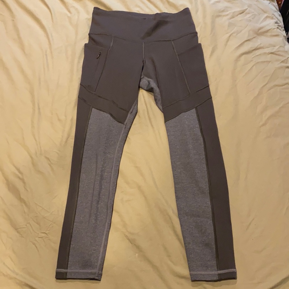 Calf-length Athleta leggings with pockets and drawstring waist